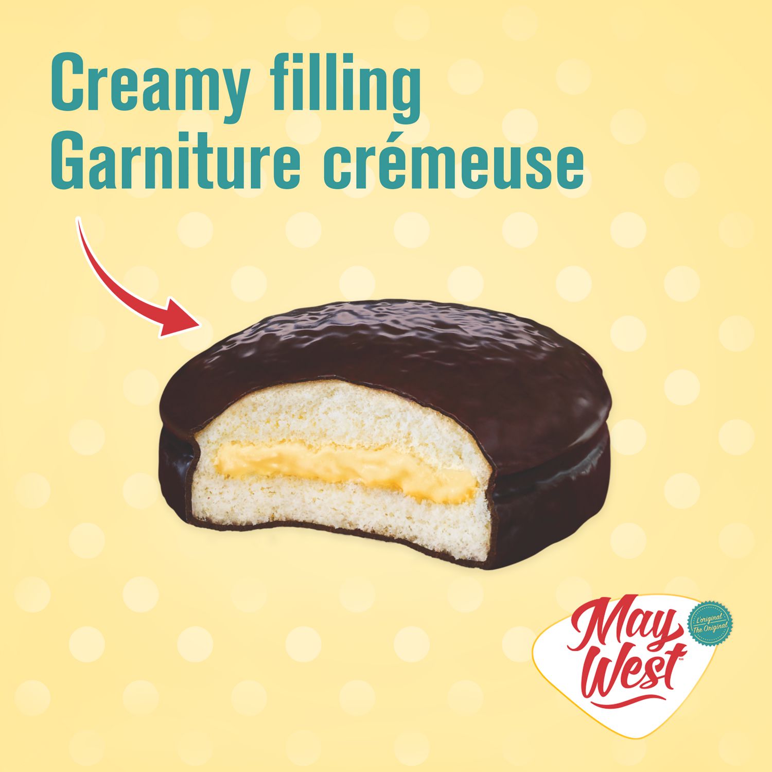 May West cake cut open showing creamy filling inside the chocolatey coating and sponge cake