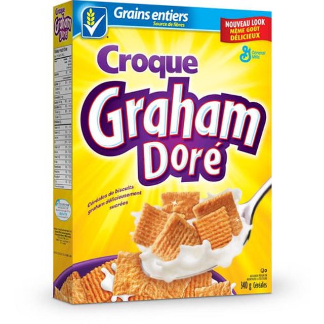 Golden Grahams Crunch cereal box displayed at an angle with cereal pieces and whole grain labeling