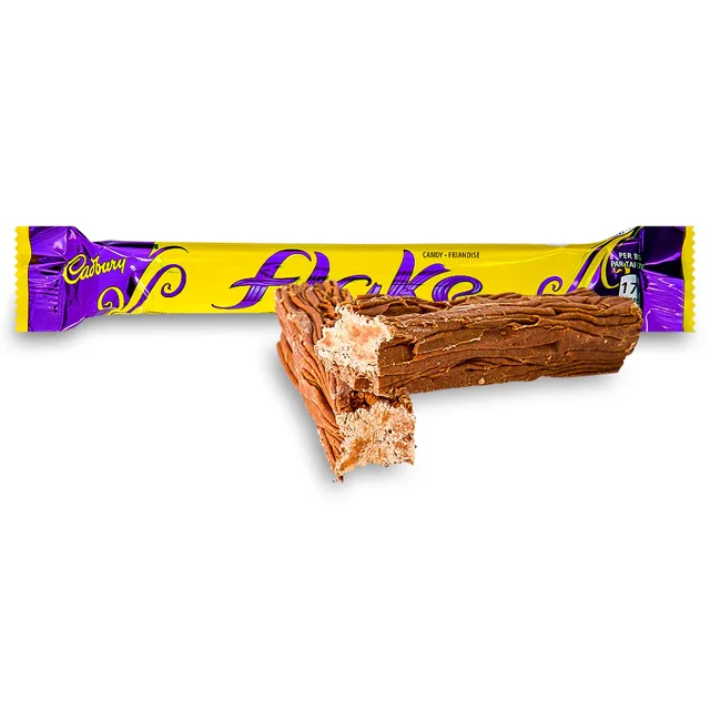 Close-up of a Cadbury Flake bar showing its thin layered milk chocolate texture