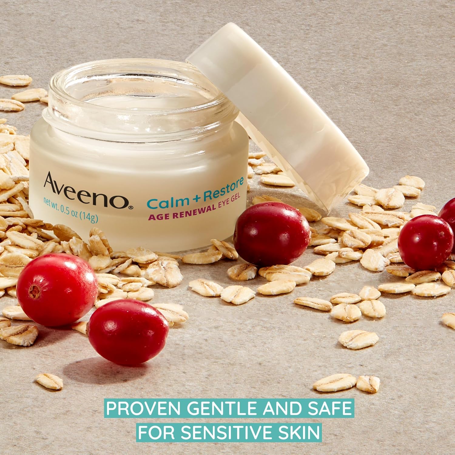 Open Aveeno Calm + Restore Age Renewal Eye Gel jar with oat flakes and cranberries