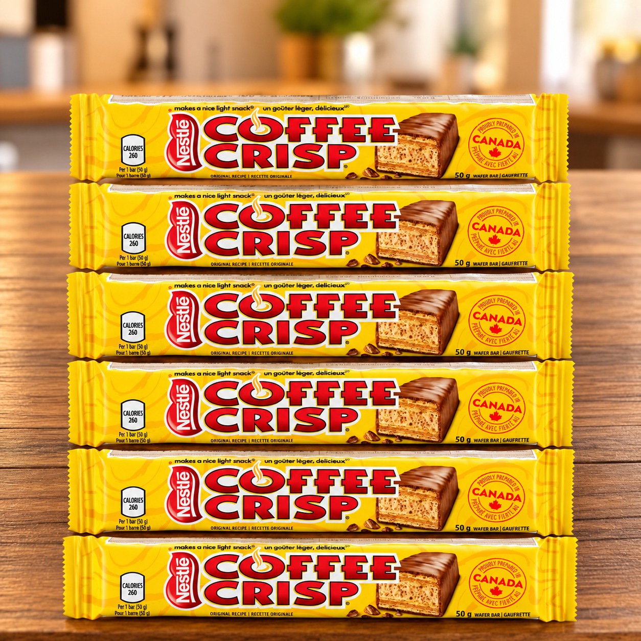Coffee Crisp 6-Pack with six 50g chocolate wafer bars arranged on a wooden table