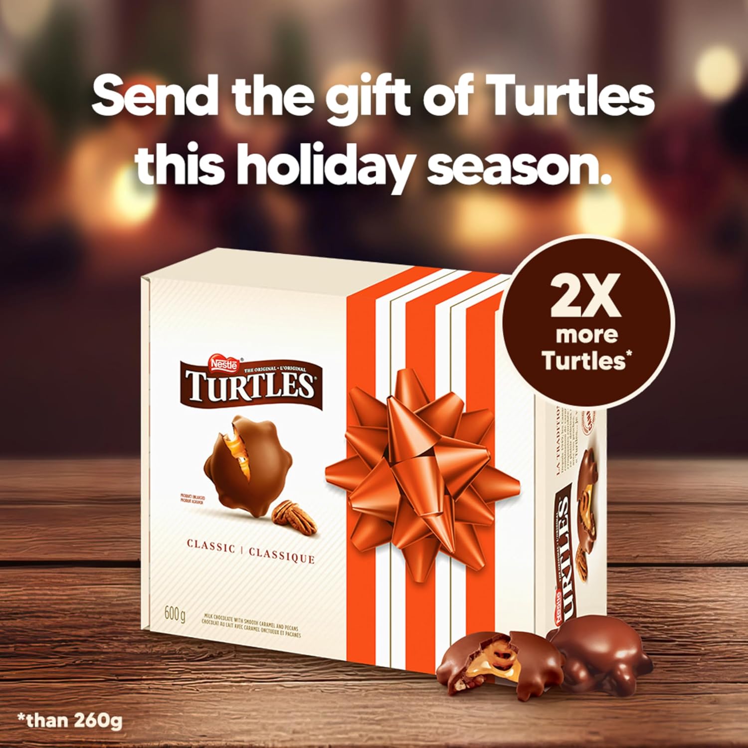 NESTLÉ TURTLES gift box displayed with chocolate treats on a wooden table