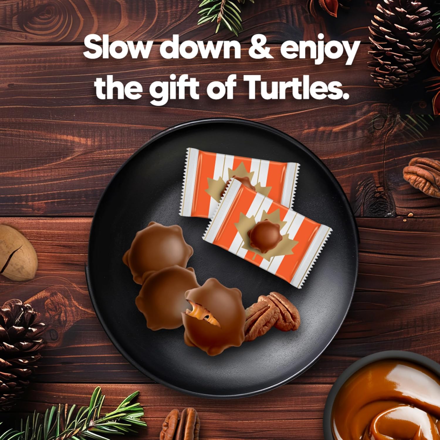 NESTLÉ TURTLES individually wrapped chocolates and pecans served on a black plate